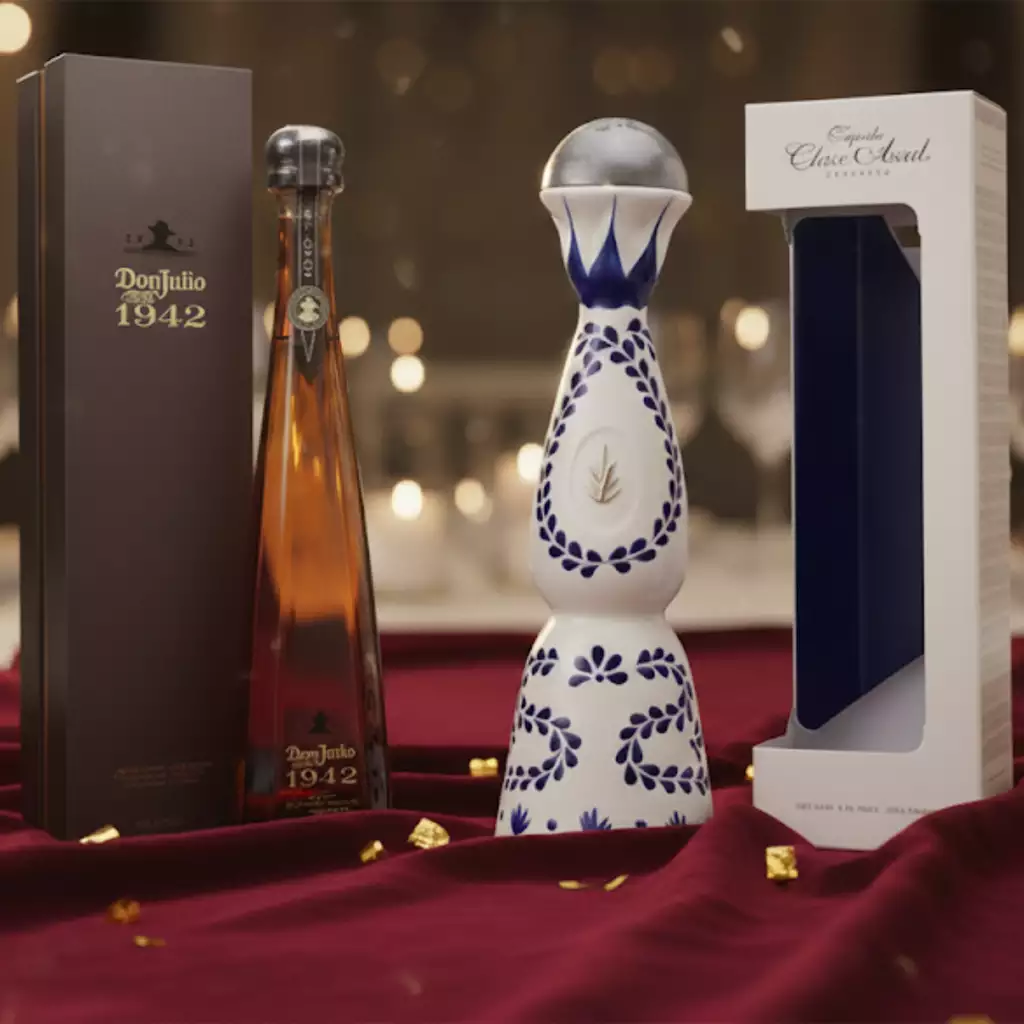Luxury Tequilas Texans Love: Clase Azul, Don Julio 1942, and More Clase Azul Reposado and Don Julio 1942 tequila bottles with gift boxes on festive table with golden lights