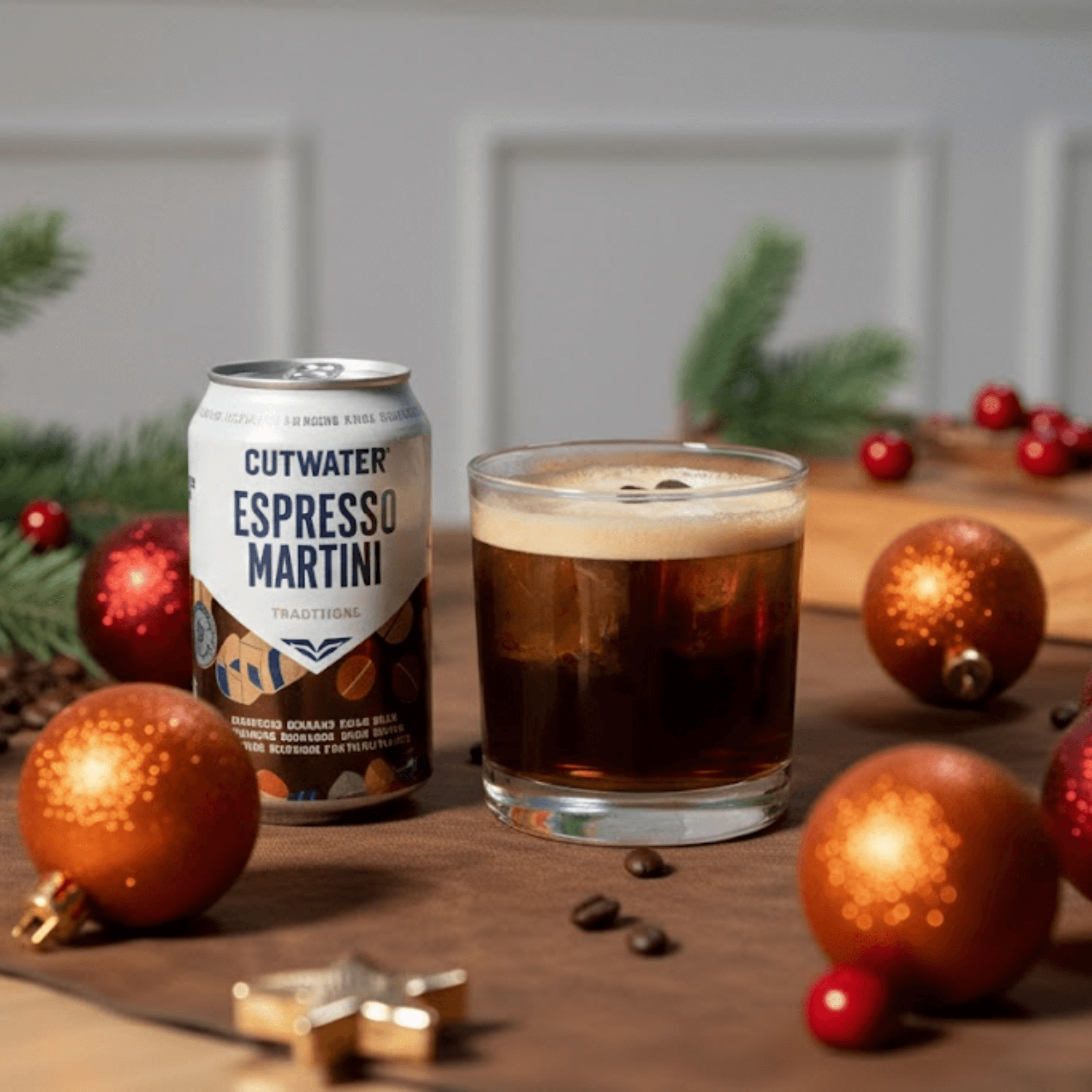Cutwater Holiday Cocktails: Festive Flavors for Every Celebration Cutwater Espresso Martini can beside a glass of iced cocktail on a decorated Texas holiday table.