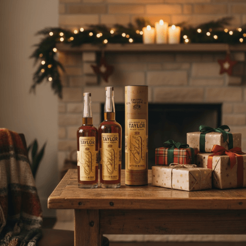 E.H. Taylor bourbons on a holiday table with gifts and warm Texas decor.