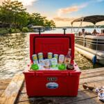 Ready-to-drink cocktails on ice at Texas lake party with boats and summer sun