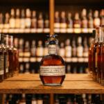 How to Get Blanton's Bourbon in Texas: Zipps' Allocated Bottle Program Explained Bottle of Blanton's Original Single Barrel Bourbon with horse and jockey stopper displayed on a wood shelf